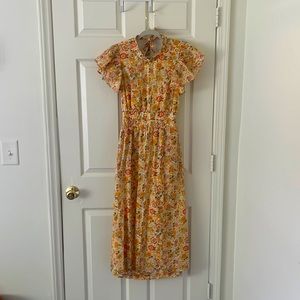 Modest maxi orange floral dress with keyhole back and high neck front.